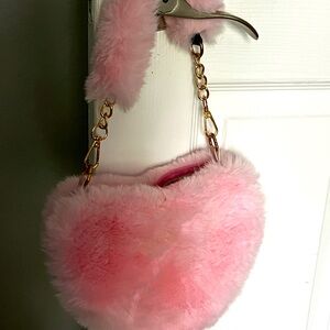 Pink fur heart purse.